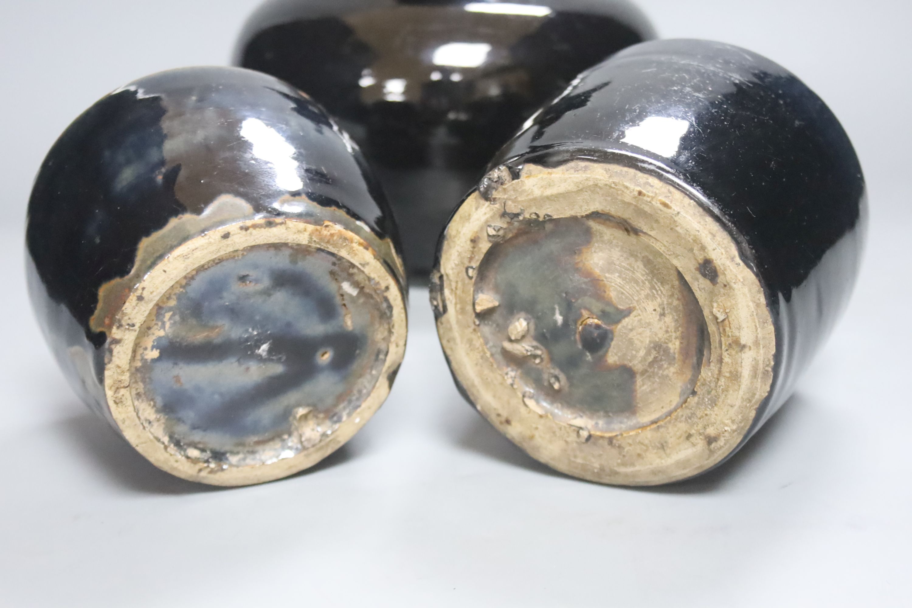 Three Chinese Shanxi black glazed jars, Qing dynasty, height 12 - 20cm